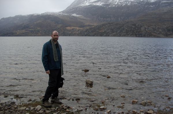 Standing at the edge of the loch.